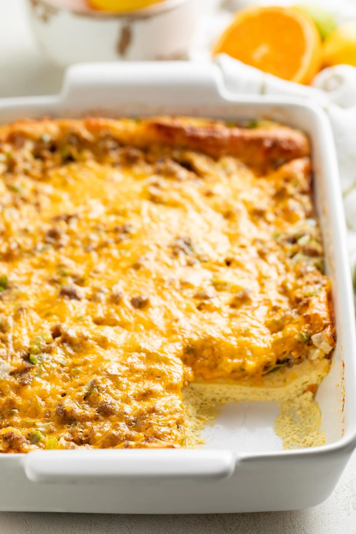 The crescent roll casserole is shown with one square removed.