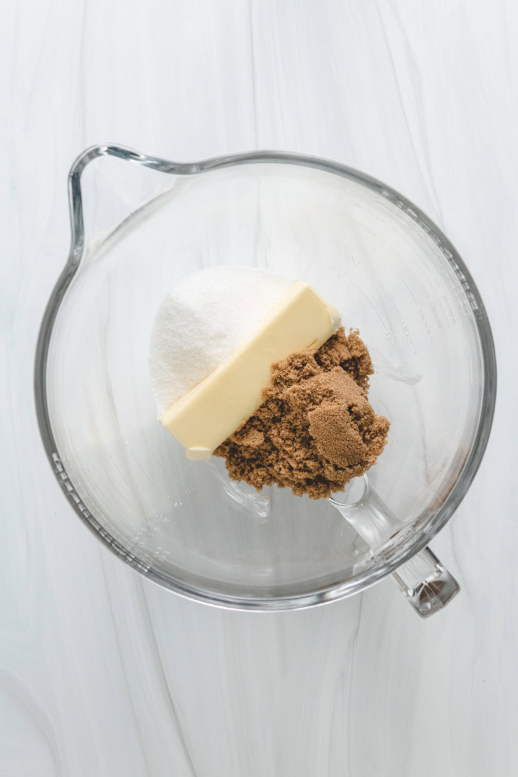 Butter, brown sugar, and granulated sugar in a mixing bowl.