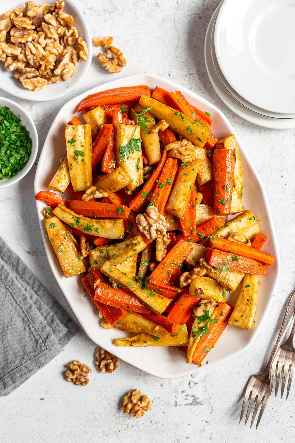 Honey roasted carrots and parsnips with walnuts and fresh parsley.