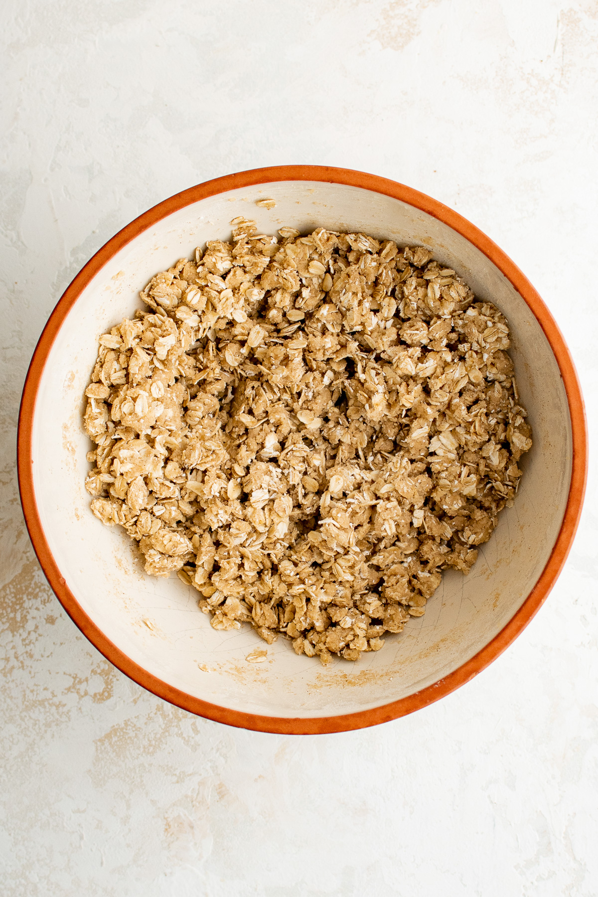 Strawberry oatmeal bar crumble mixture in a bowl.