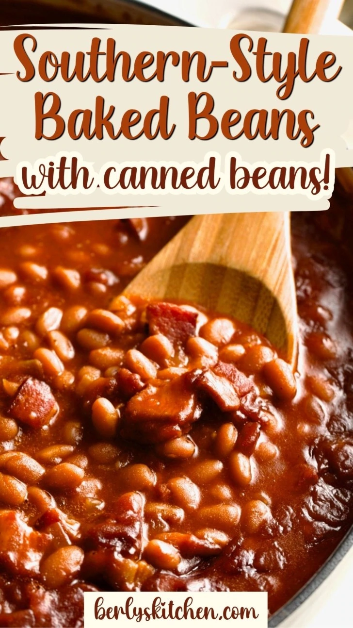 Close up view of a wooden spoon in a pan of baked beans.