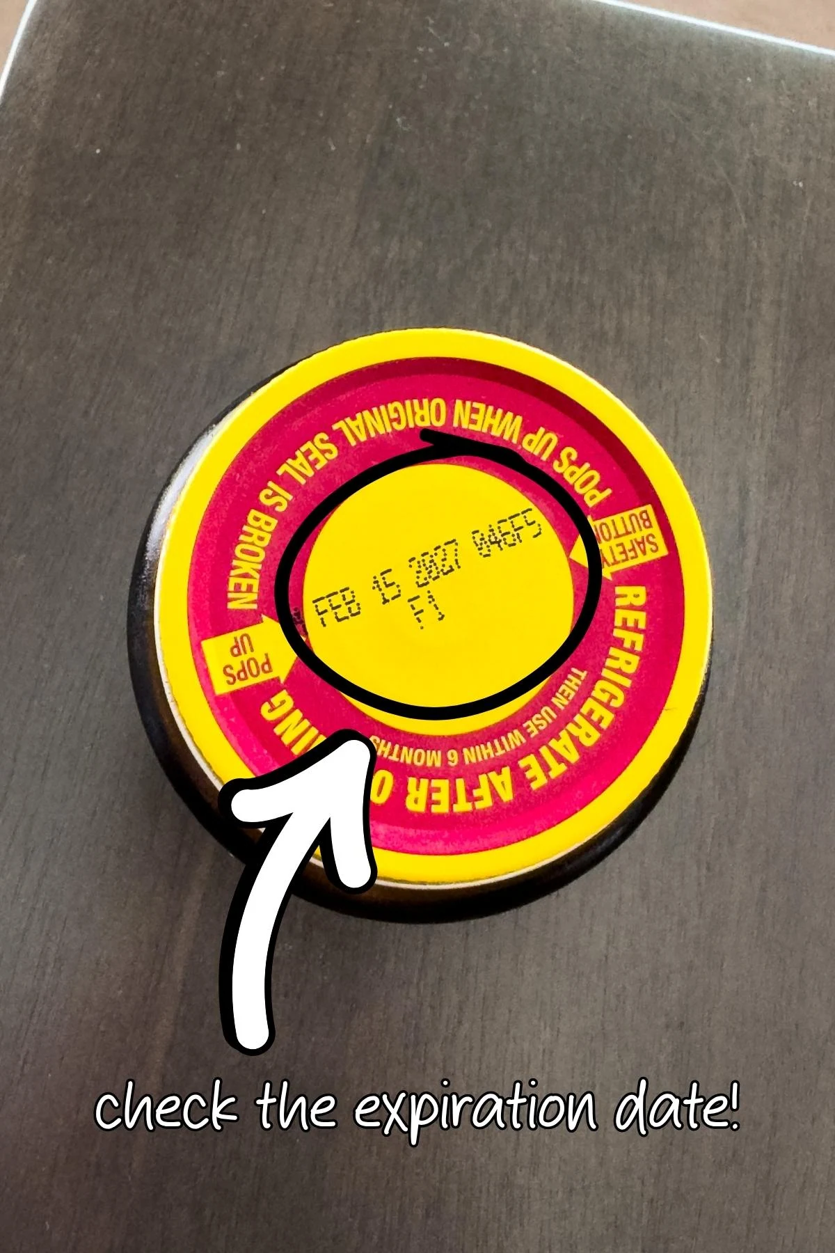 Jar of yeast showing hte expiration date.