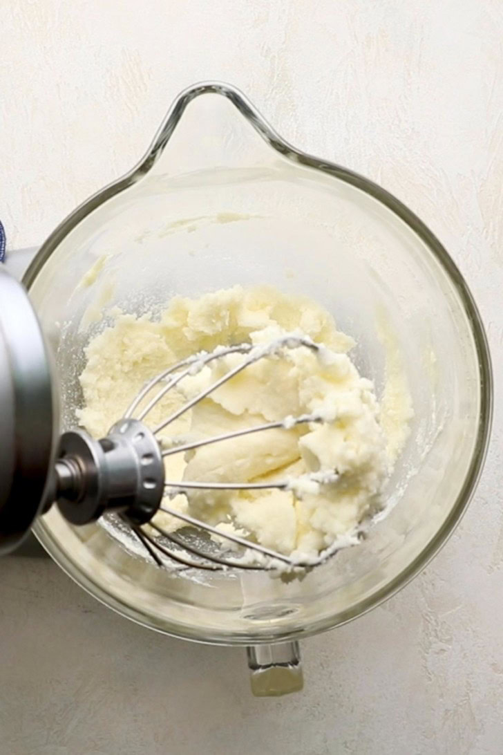 Butter and sugar mixed in a stand mixer.