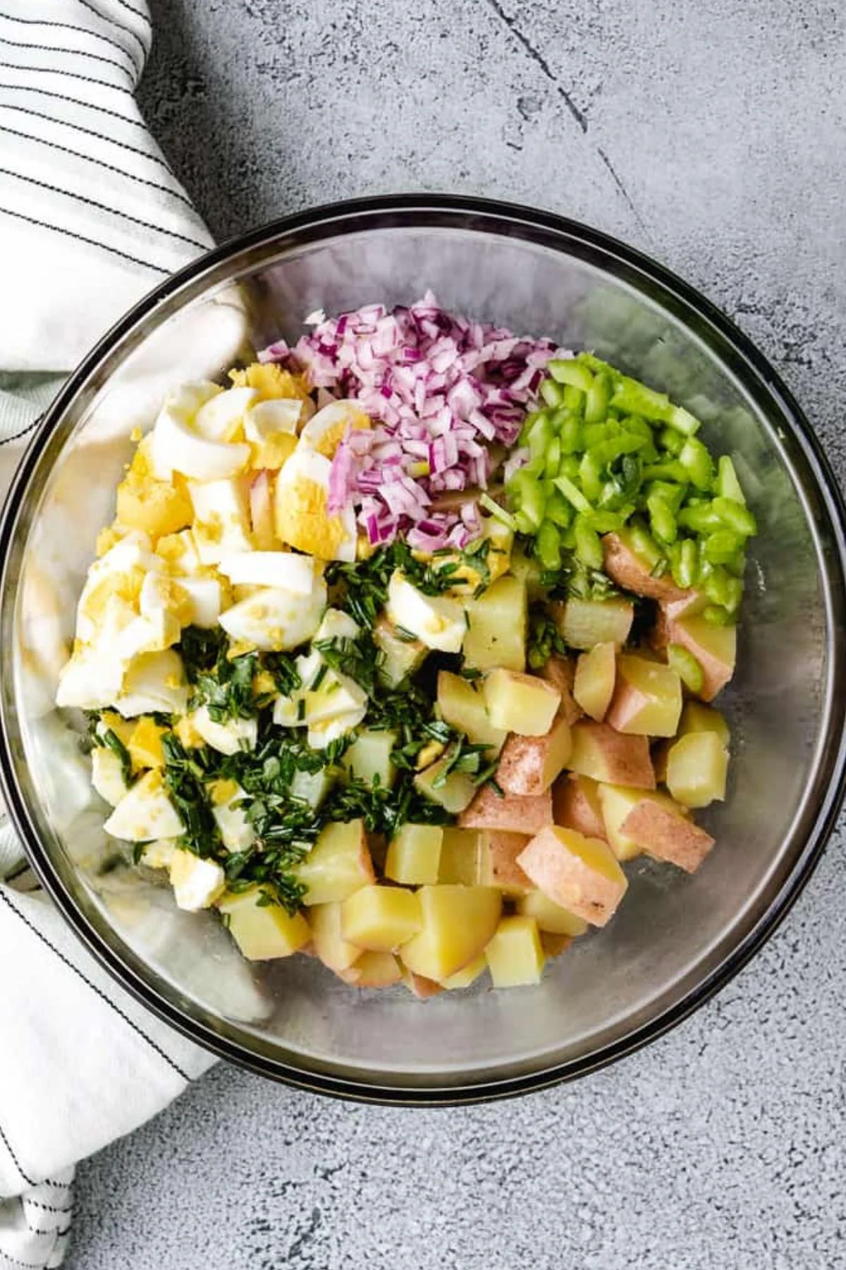 Mustard vinaigrette added to the potato salad ingredients.