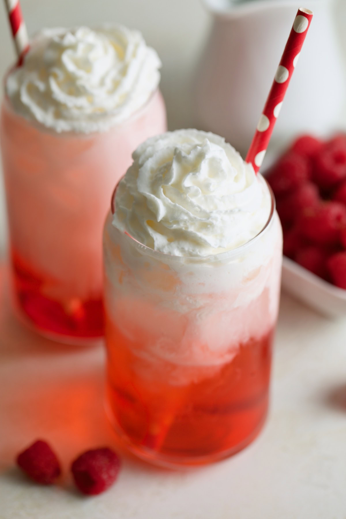 Close-up of raspberry Italian cream soda with whipped cream.