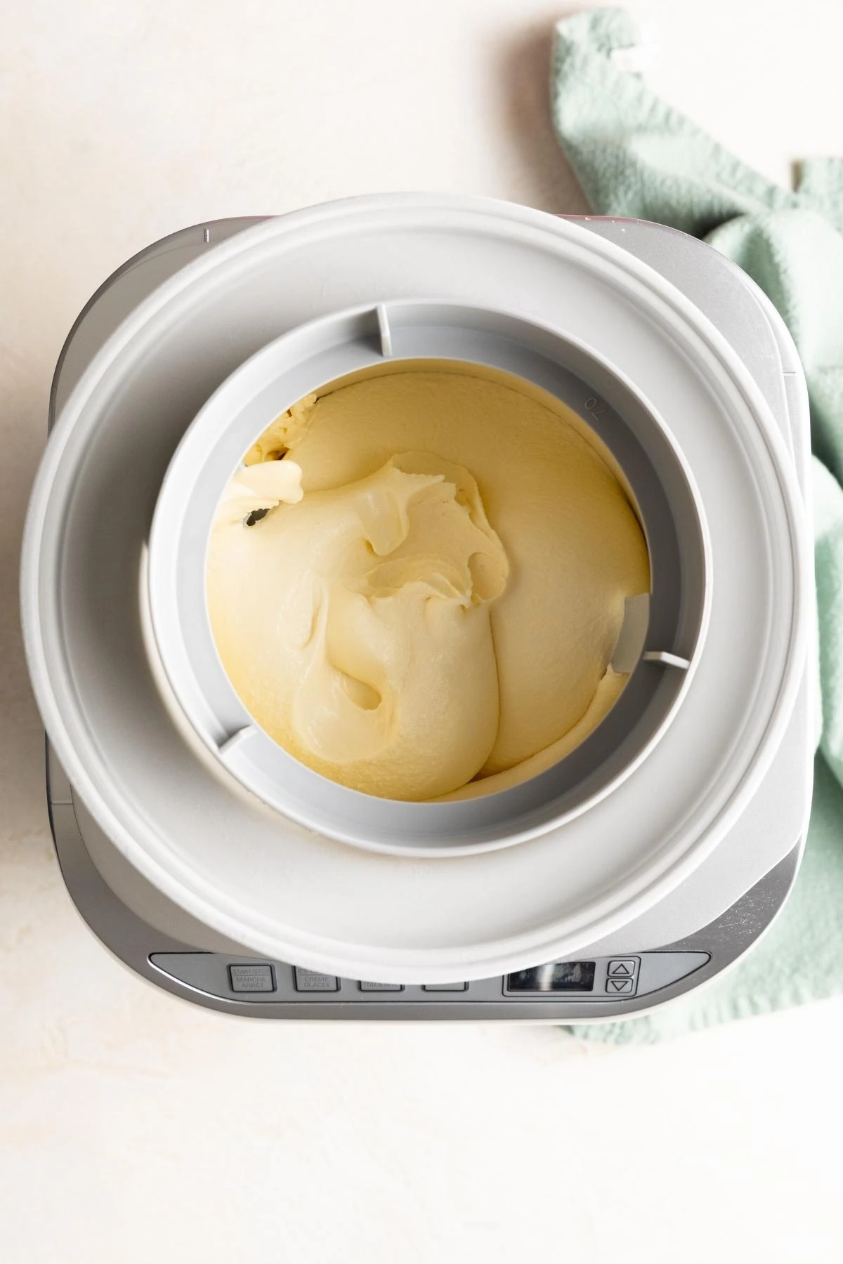 Freshly churned vanilla ice cream in an ice cream maker.