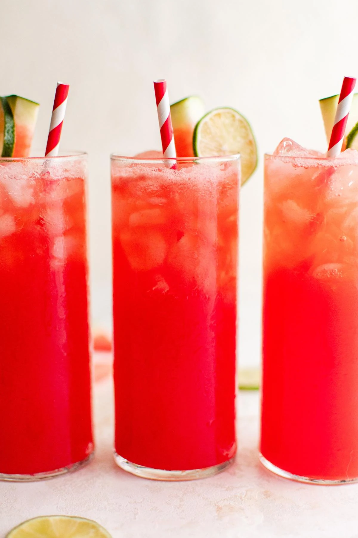 Three glasses of watermelon agua fresca.