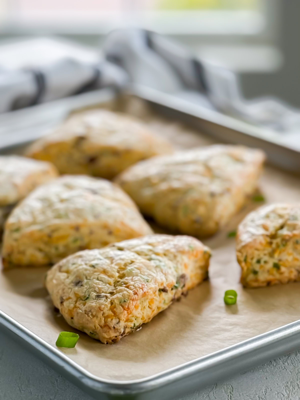 Bacon cheddar scones on a baking sheet.