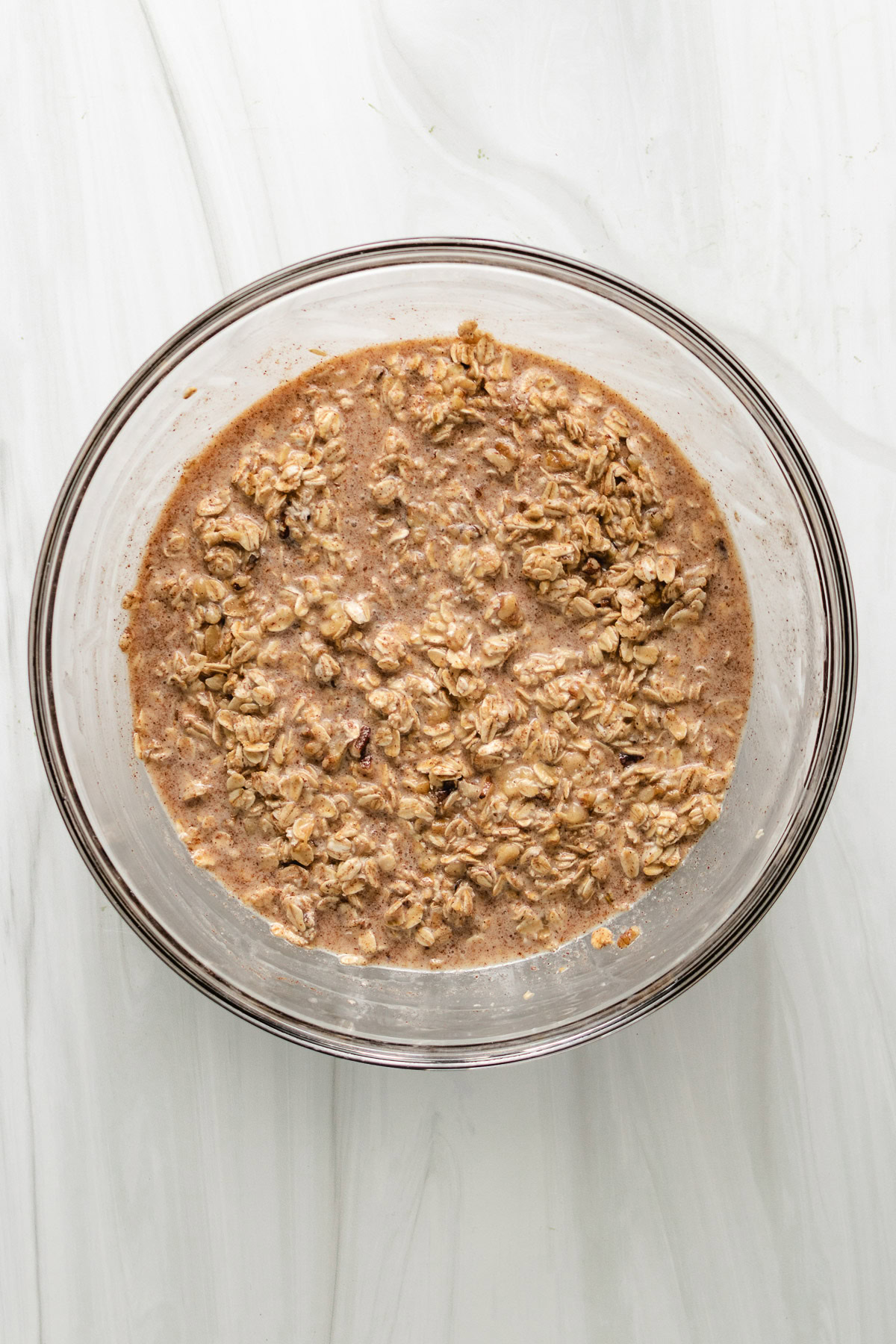 Mixing bowl filled with baked oatmeal mixture.