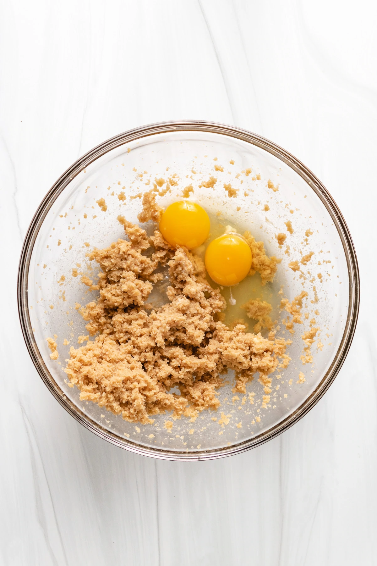 Eggs added to brown sugar and butter mixture.