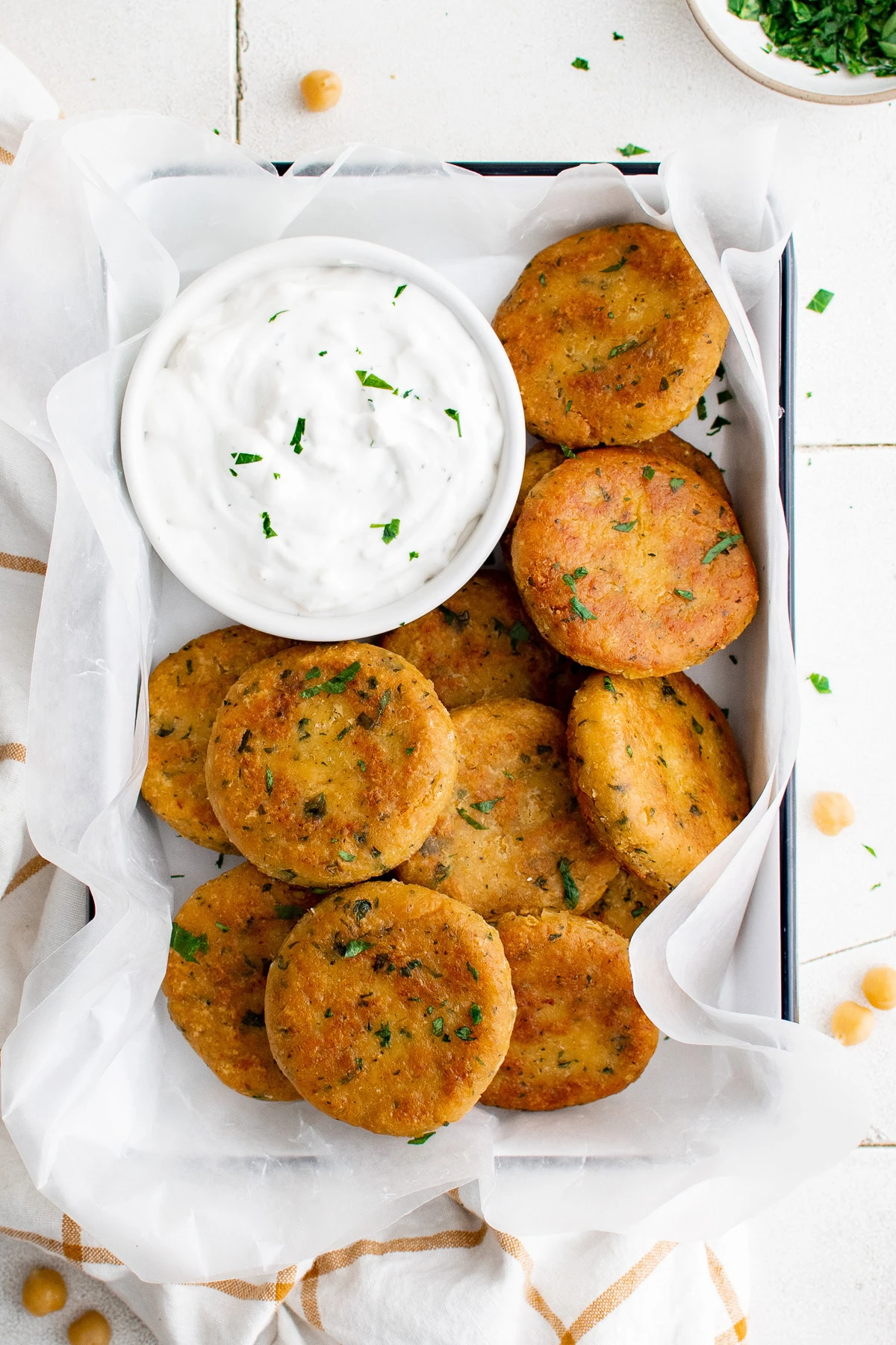 Overhead view of chickpea fritters on a platter.