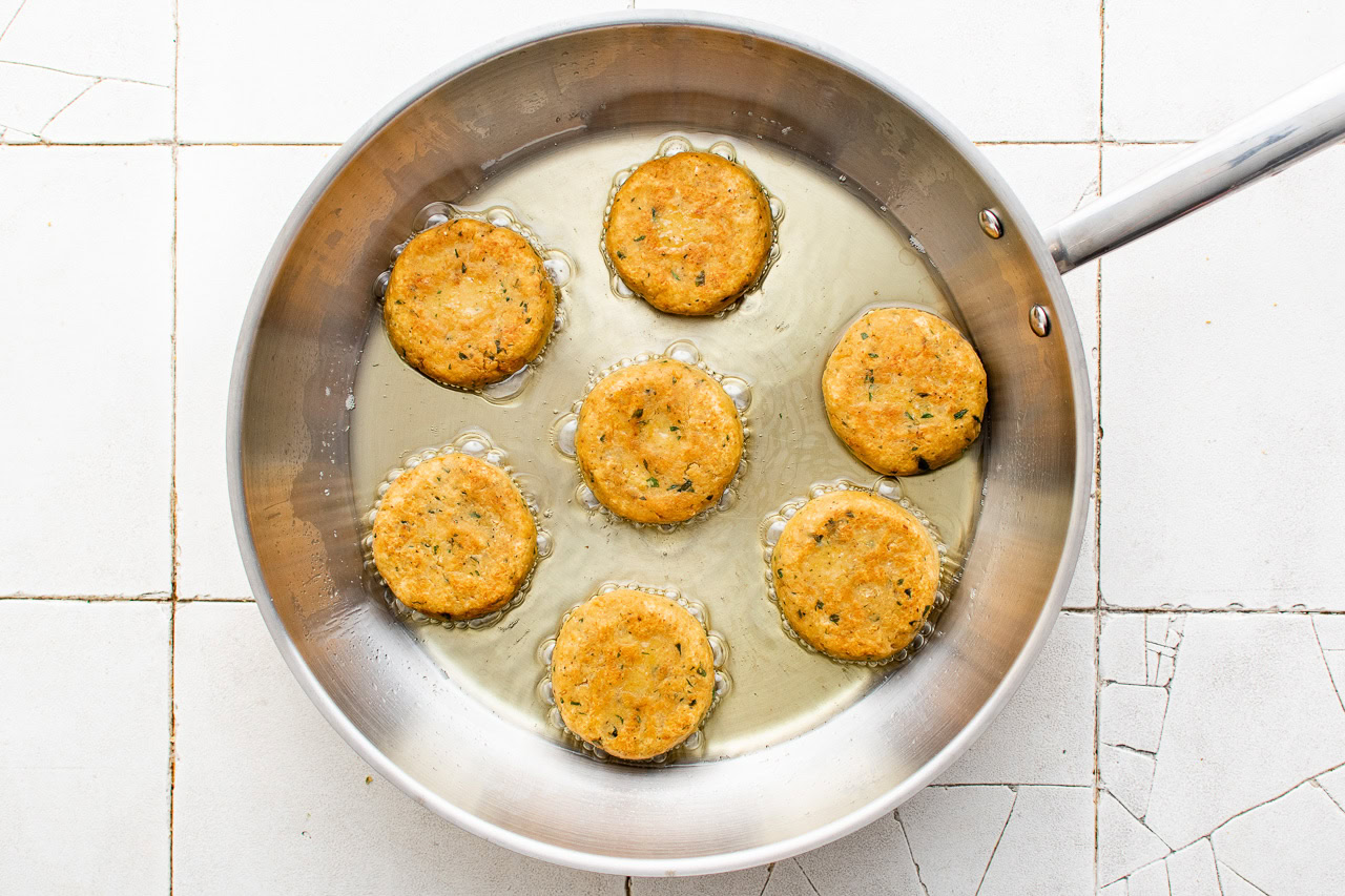Chickpeas cooking in a skillet.
