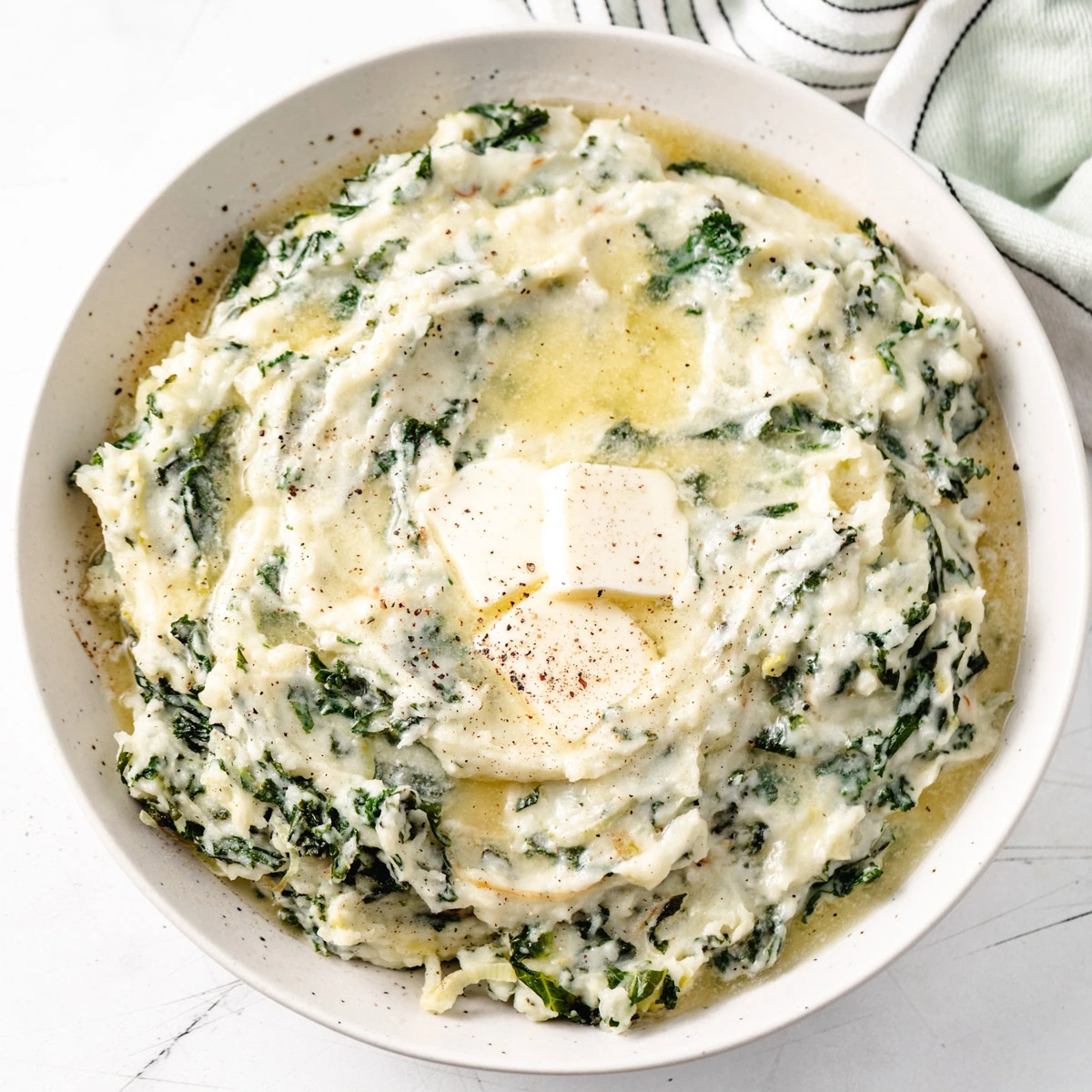 Overhead view of colcannon in a speckled dish.