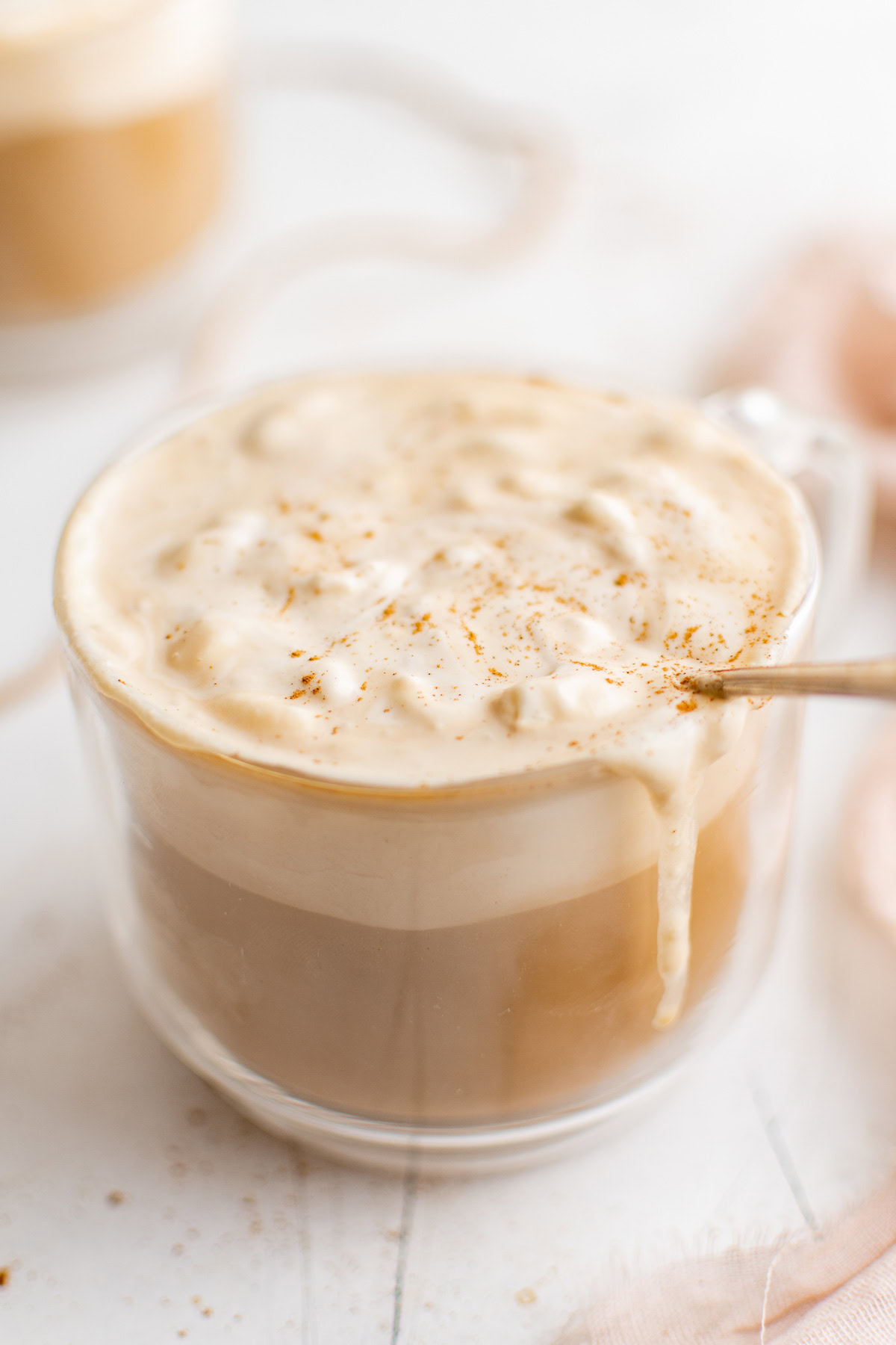 Large mug of eggnog latte with whipped topping.