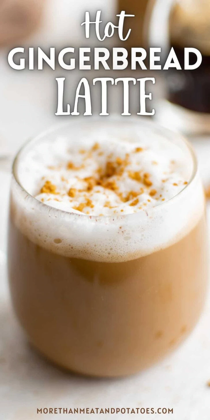 Mug filled with gingerbread latte and whipped cream.