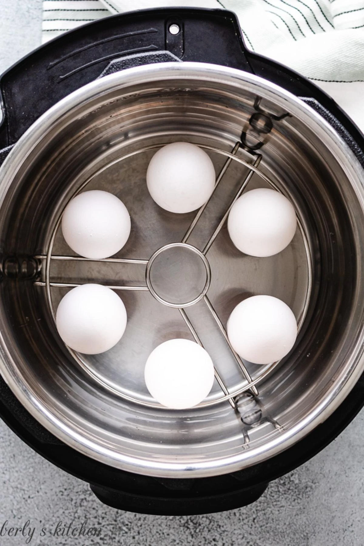 Six eggs cooking in an instant pot for breakfast or recipe prep.