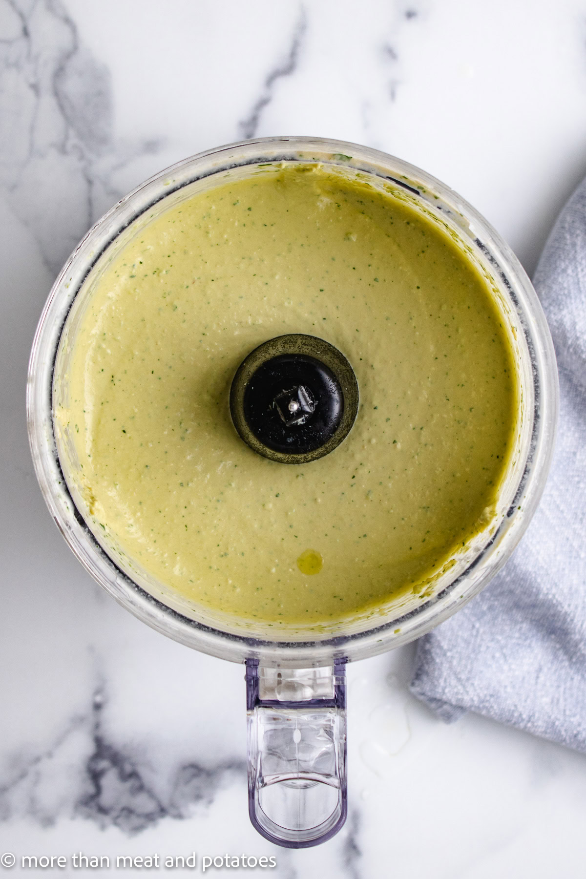 Creamy hummus in a food processor.