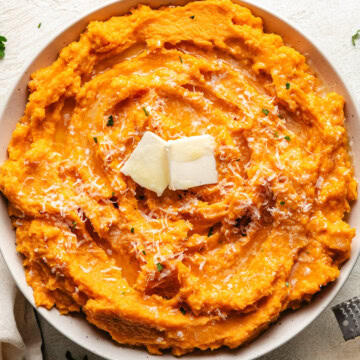 Overhead view of a bowl filled with mashed sweet potatoes.