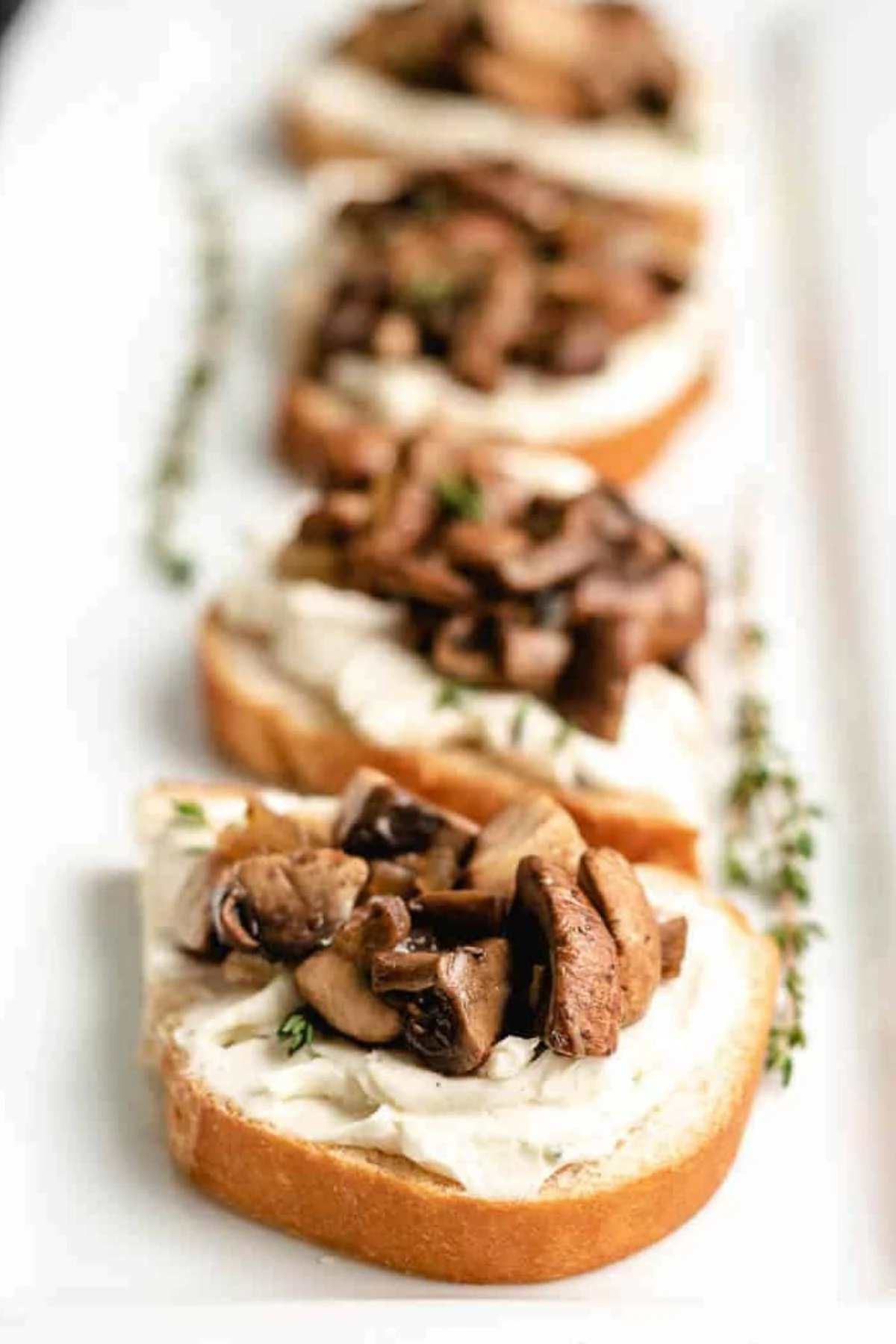 Large platter of creamy mushroom toast.