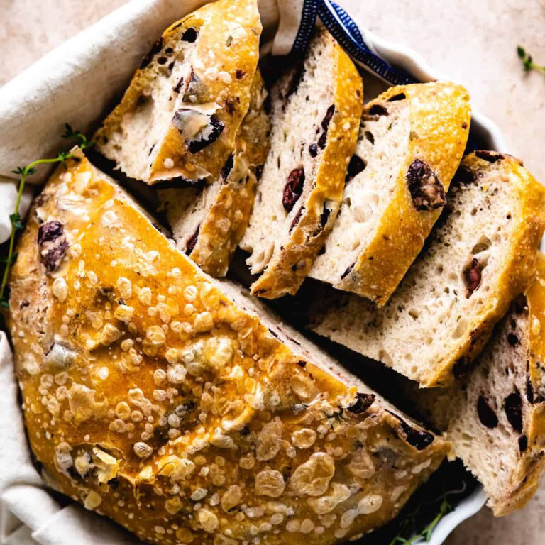 Loaf of olive oil bread in a towel.