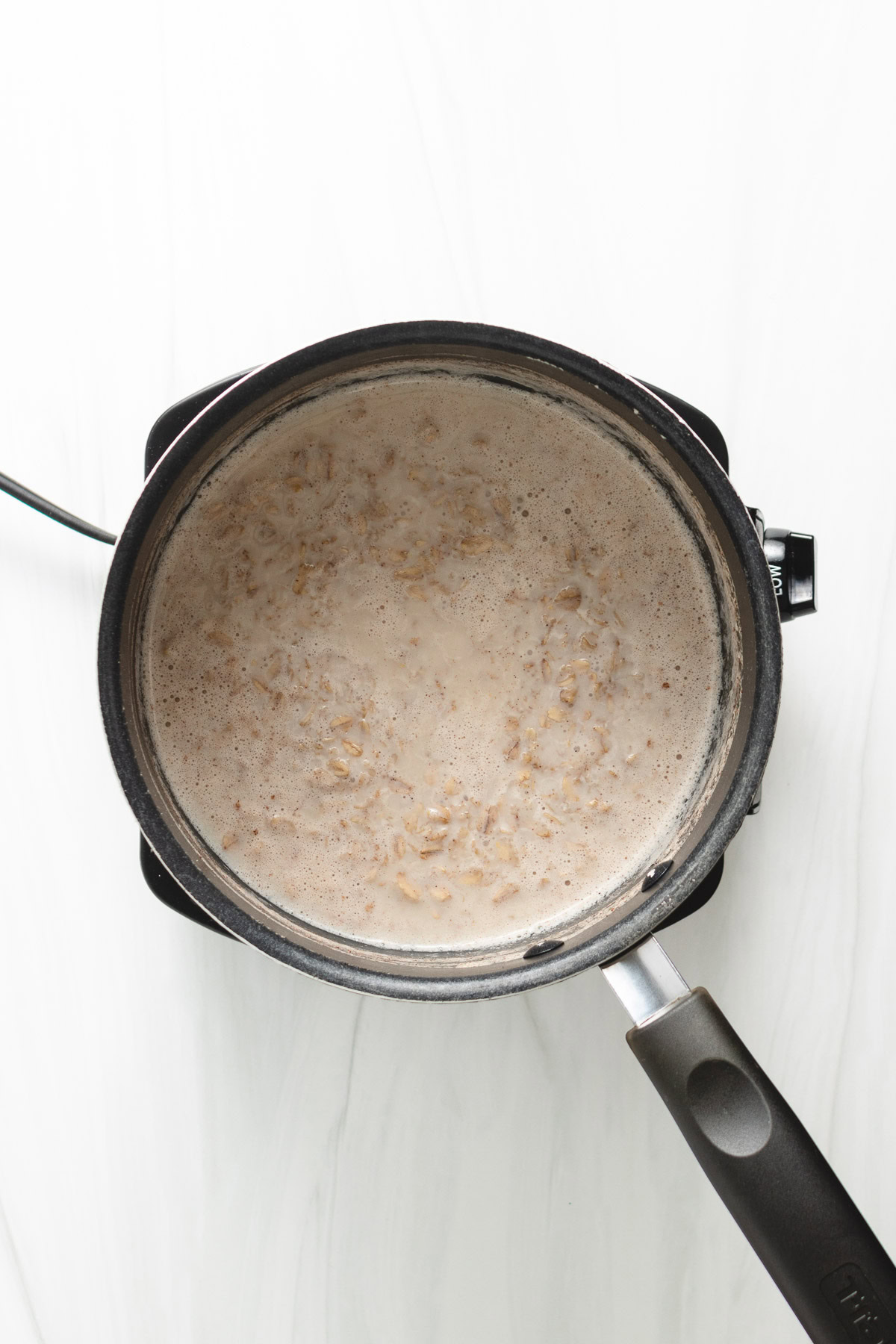Oatmeal cooking in milk and water.