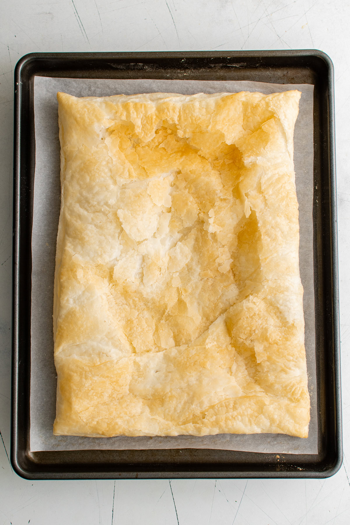 Baked puff pastry on a baking sheet.