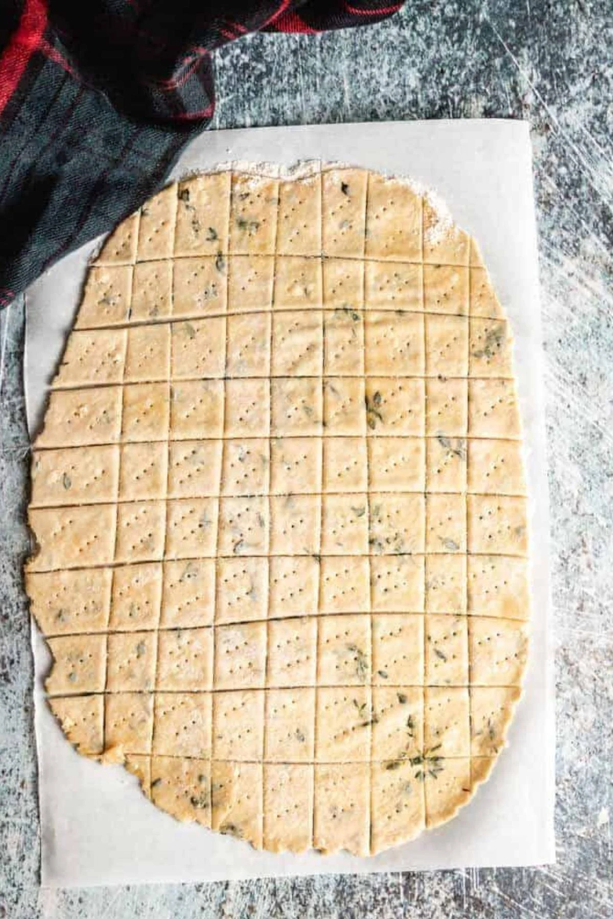 Squares cut into cracker dough.