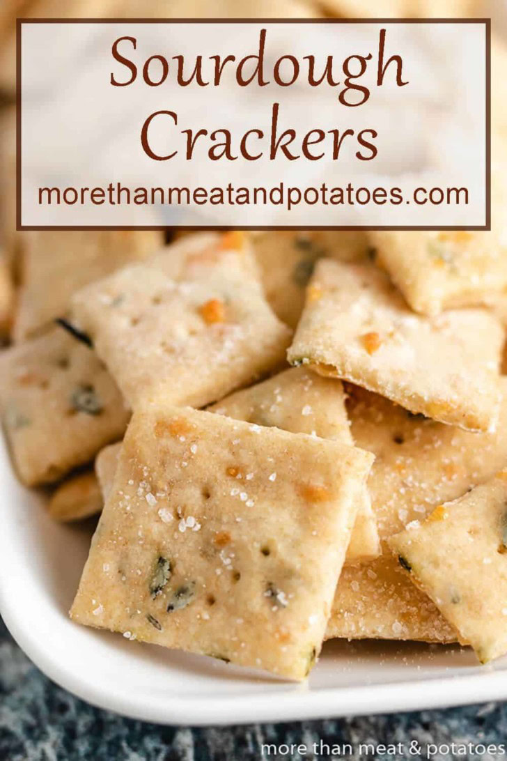 Close up view of parmesan sourdough crackers on a platter.