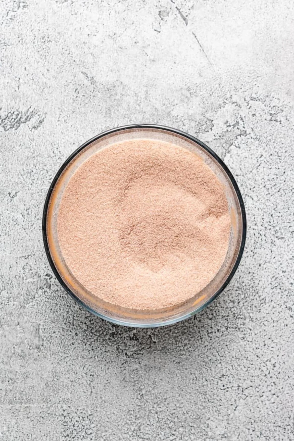 Cinnamon and sugar mixed in a bowl.