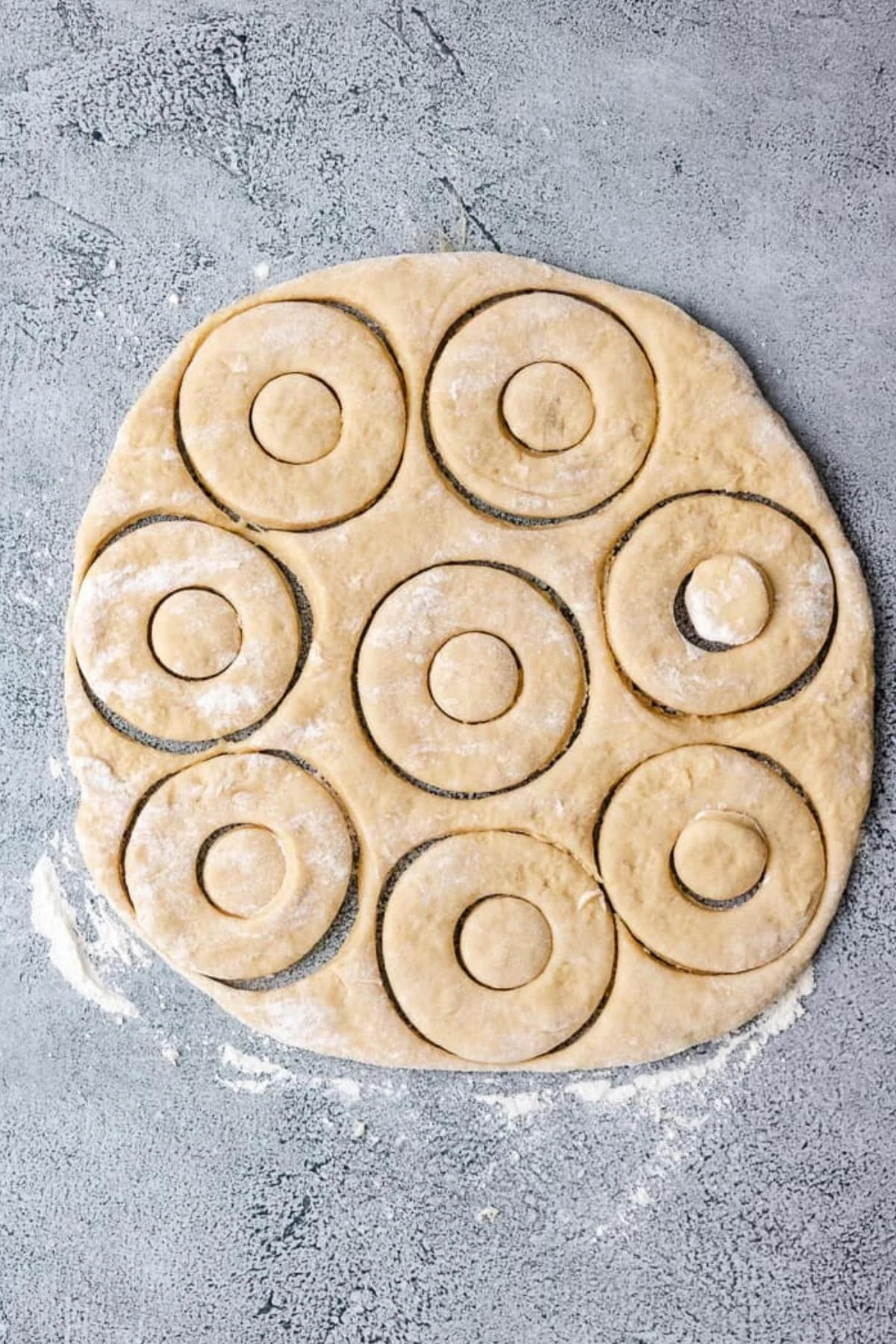 Doughnuts cut out of dough.