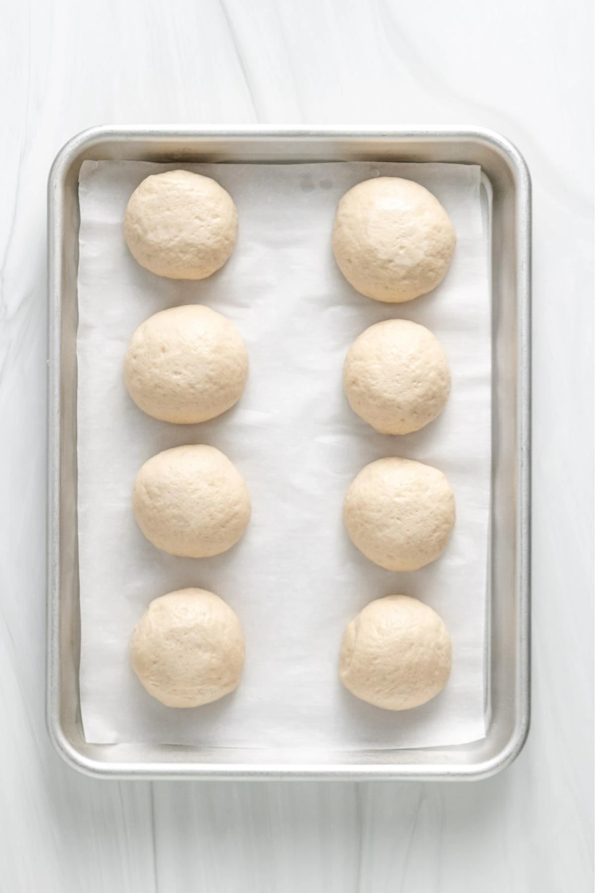 Balls of dough used to make sourdough naan.