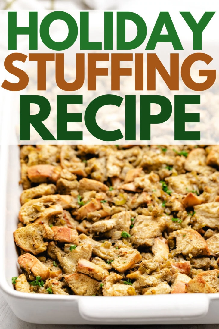 Thanksgiving stuffing filling up a white baking dish.
