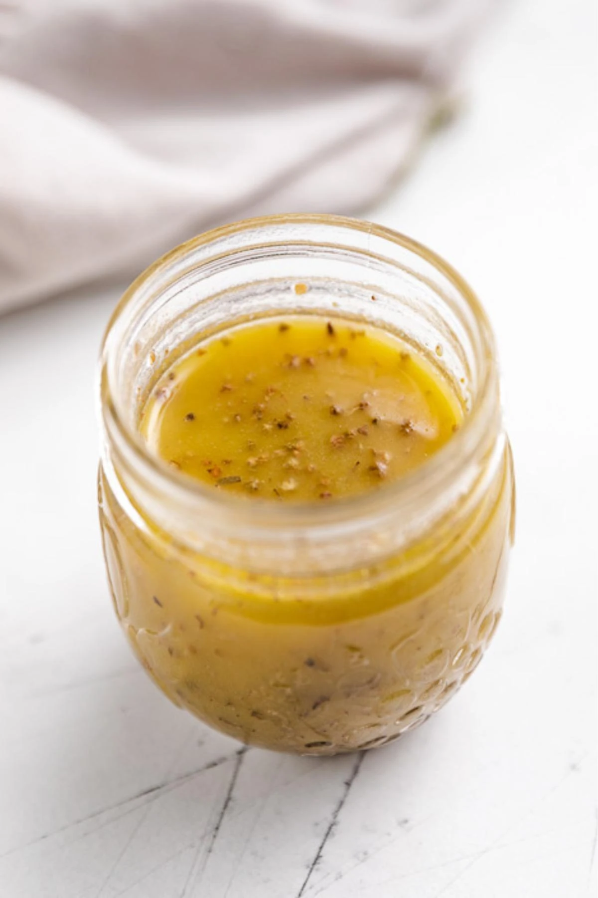 Jar of white wine vinaigrette salad dressing.