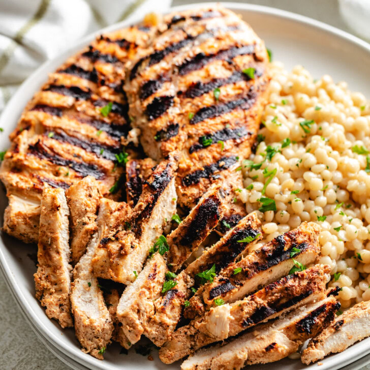 Close up view of yogurt marinated chicken on a plate.