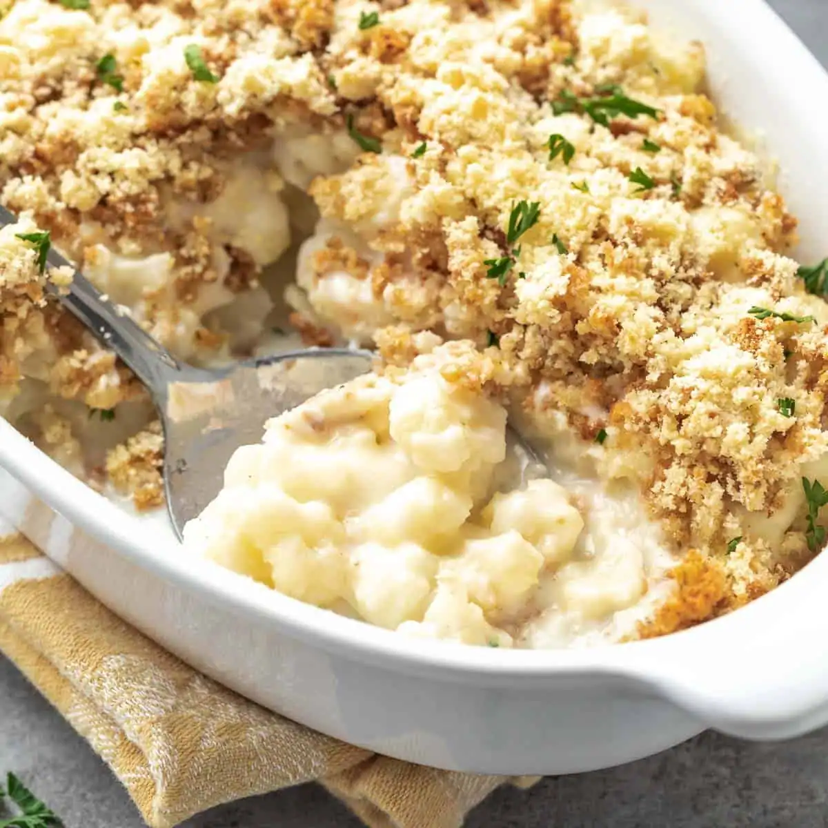 Creamy cauliflower casserole in a baking dish.