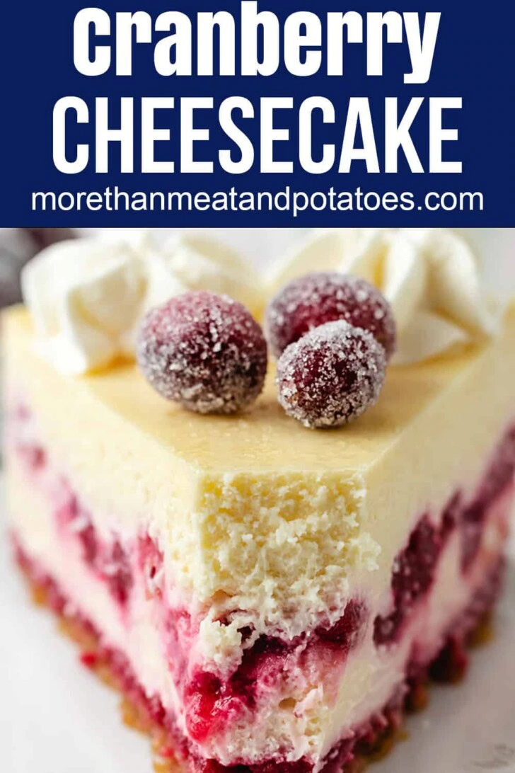 Sugared cranberries on top of a slice of cranberry cheesecake.