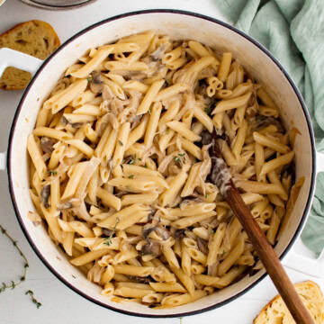 Overhead view of French onion pasta with mushrooms and caramelized onions.