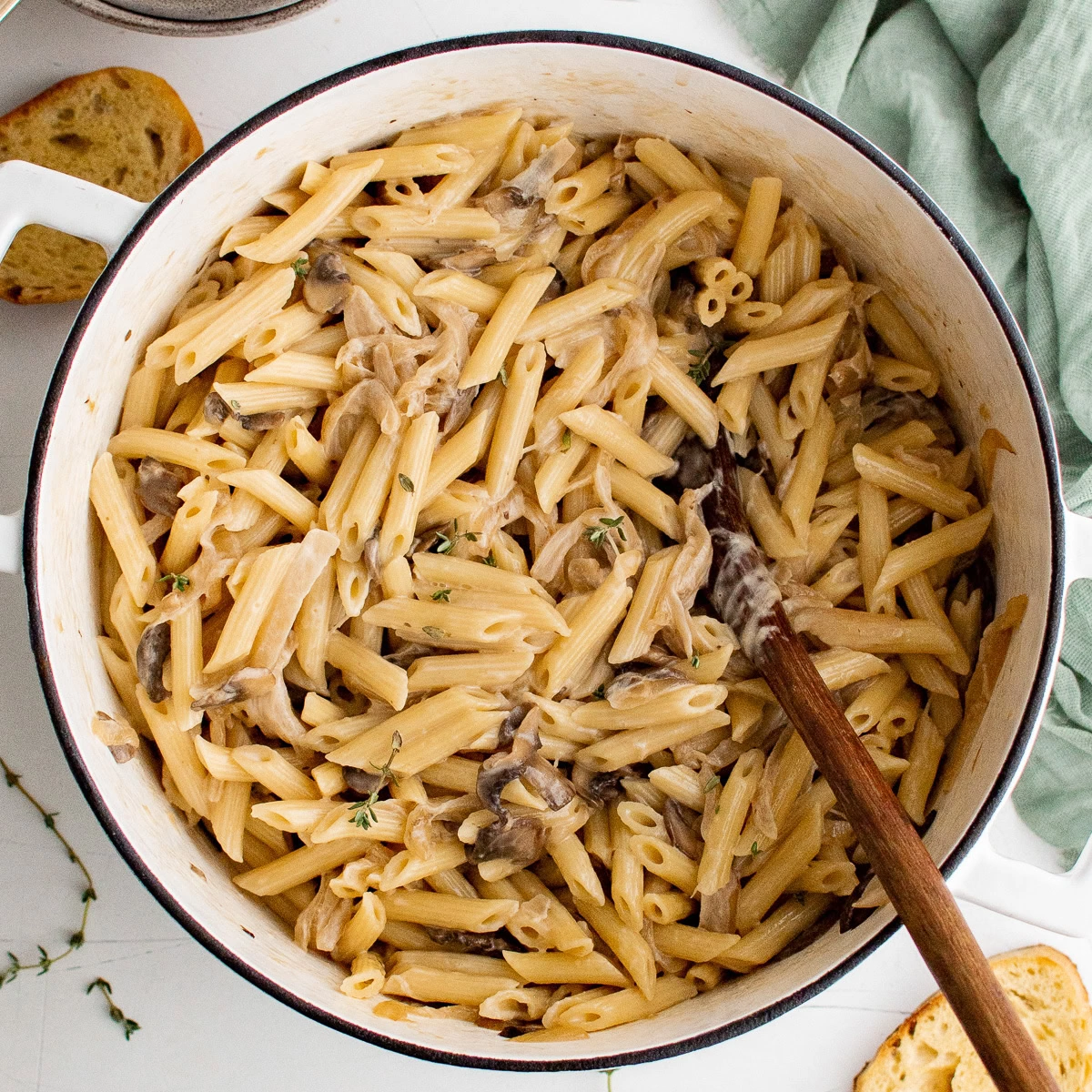 Overhead view of French onion pasta with mushrooms and caramelized onions.
