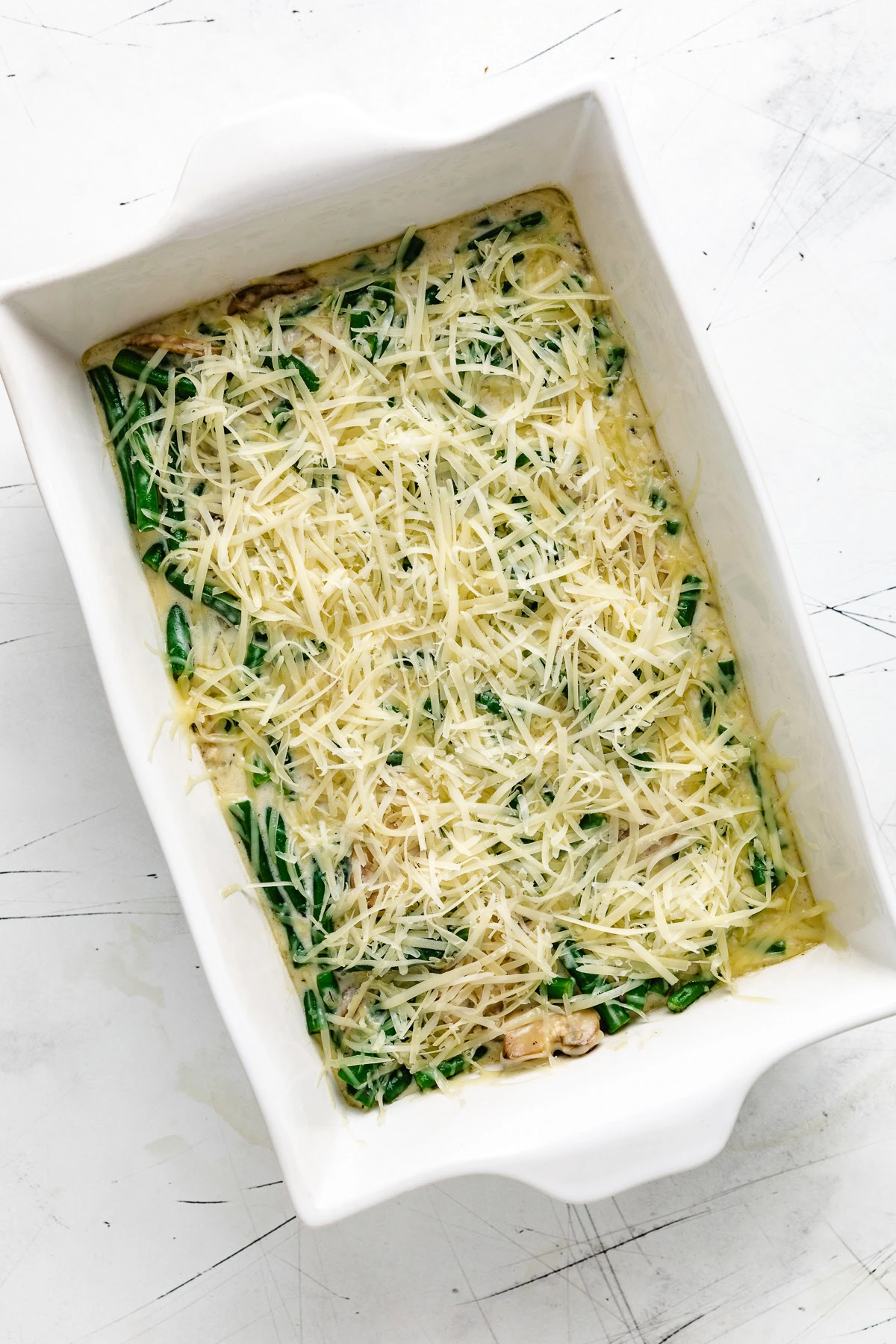 Shredded cheese added to the green bean casserole.