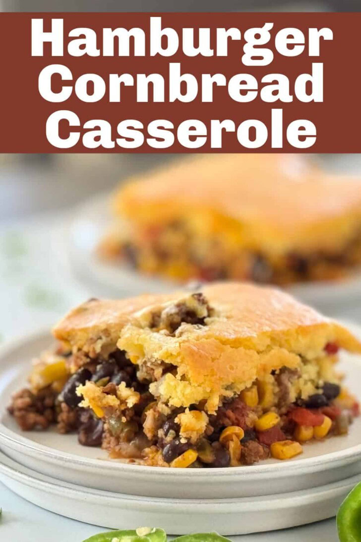 Beefy cornbread and veggie casserole on a gray plate.