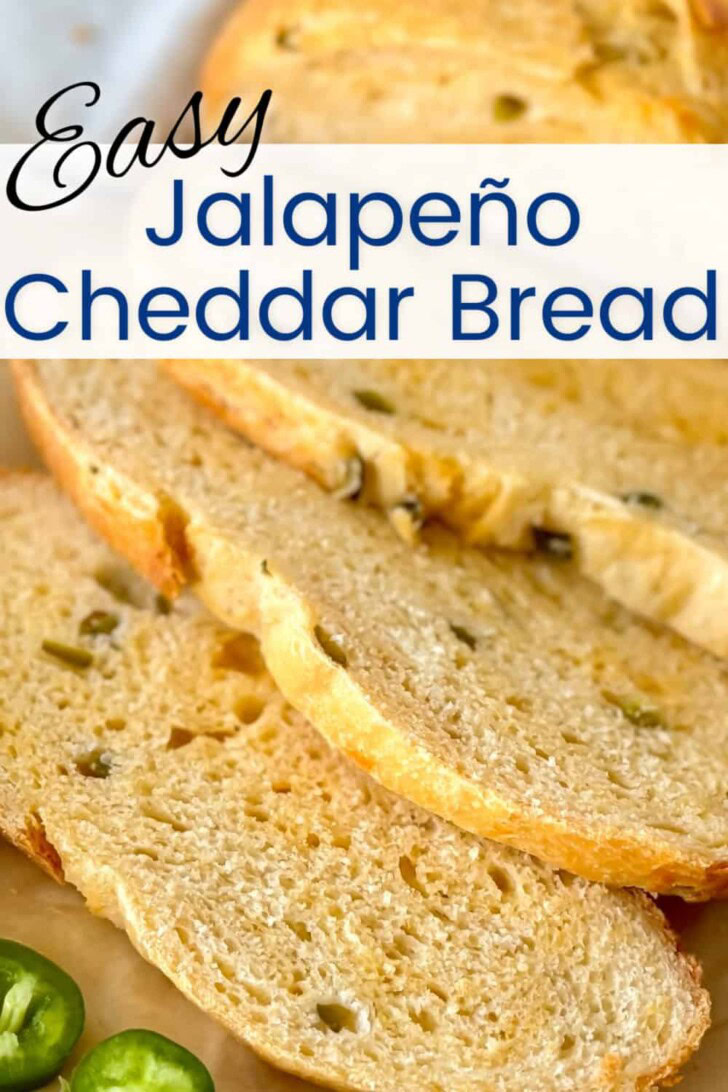Jalapeno cheddar bread sliced on a cutting board.