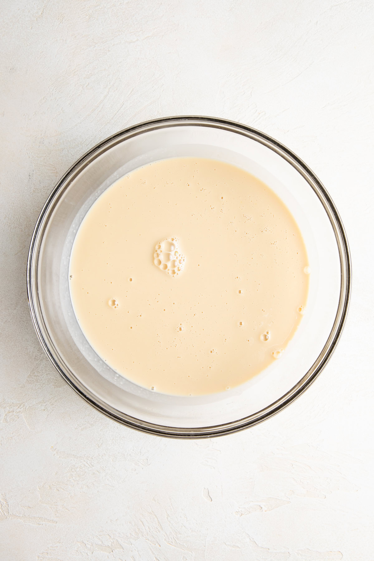 Kahlua ice cream custard base cooling in a glass bowl.