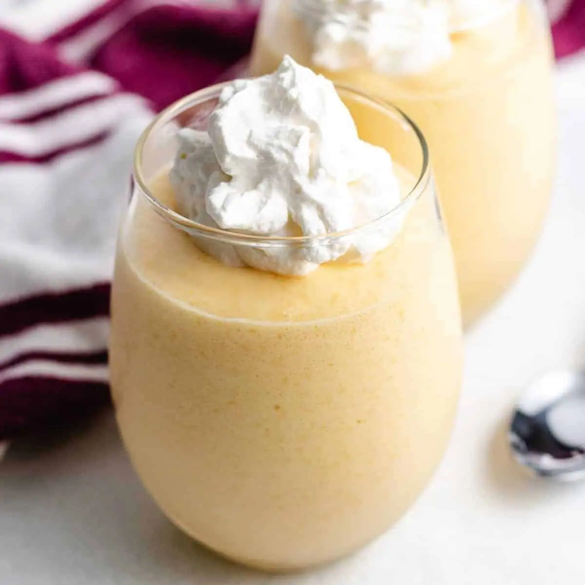 Mango mousse in serving glasses.