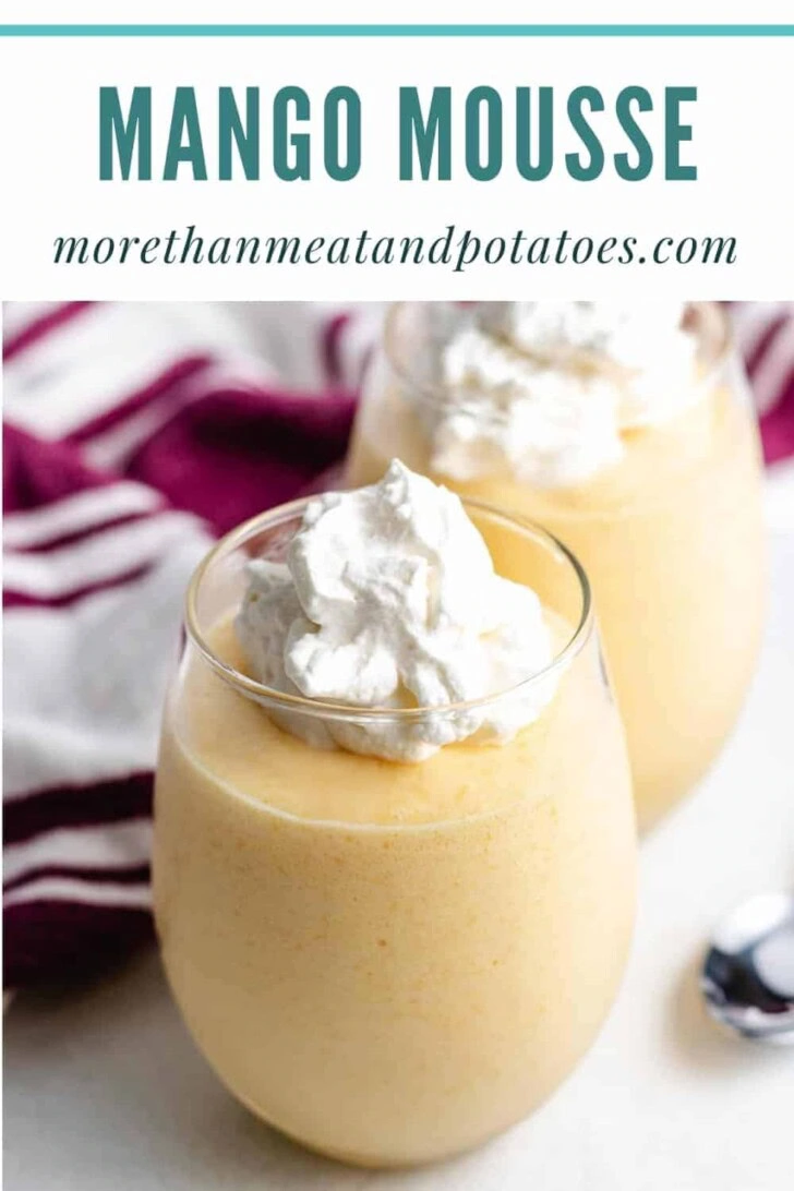 Whipped cream on top of mango mousse.