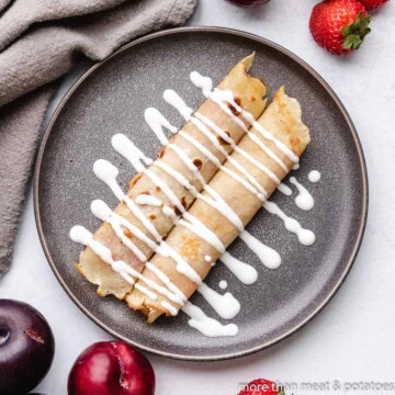 Overhead view of Hungarian pancakes (palacsintas) on a plate.