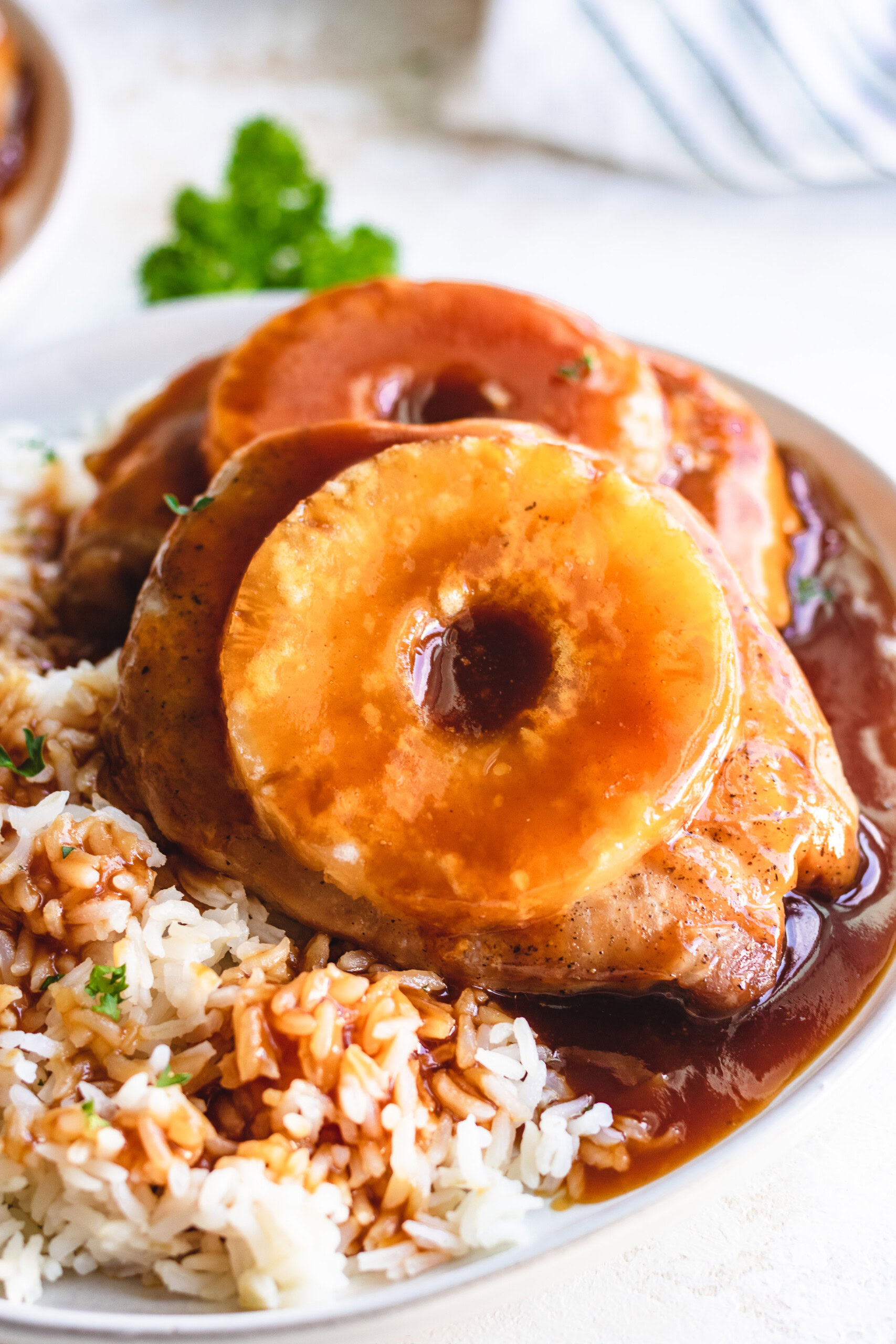 Close up view of pineapple pork chops with rice.