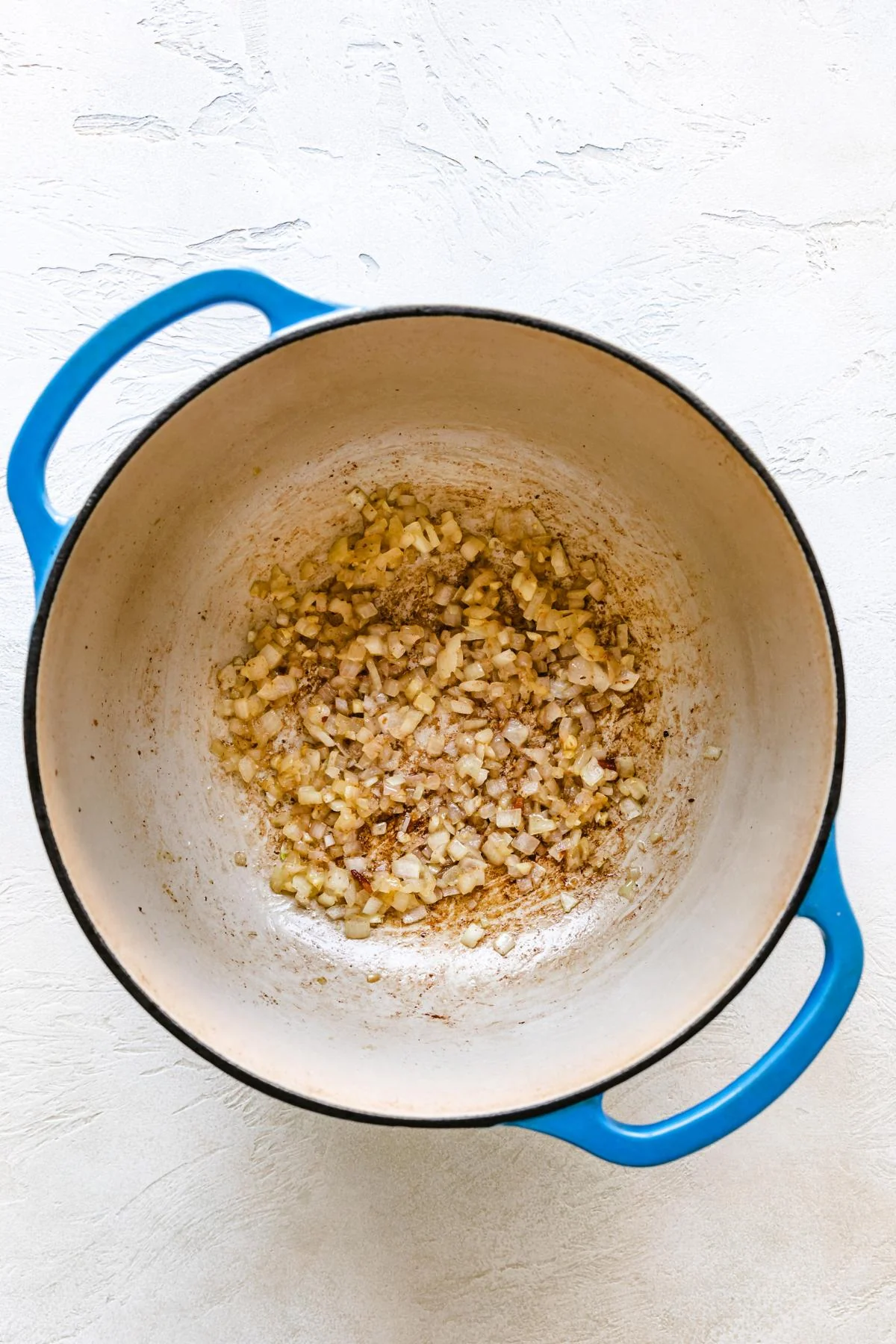 Onions cooking in a Dutch oven.
