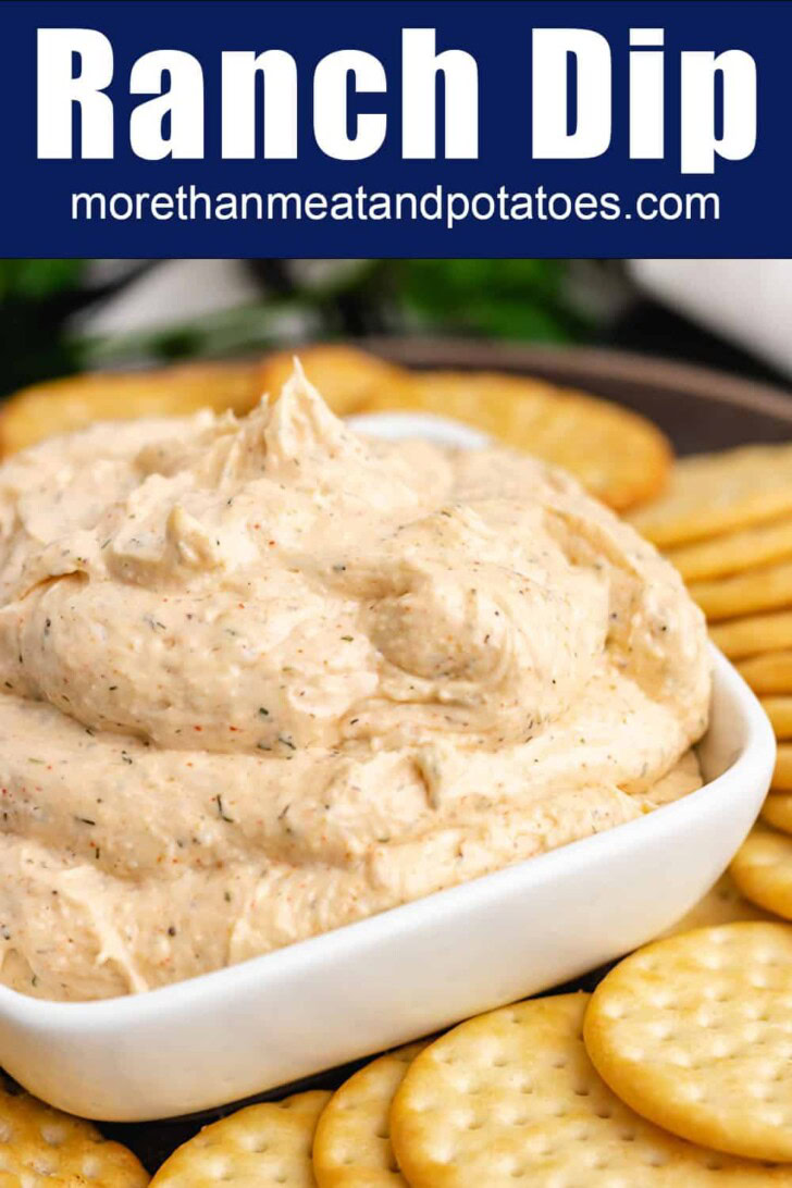 Close up view of ranch cream cheese dip in a white dish.