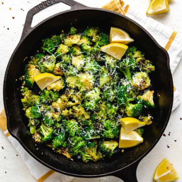 Overhead view of sauteed broccoli in a skillet.