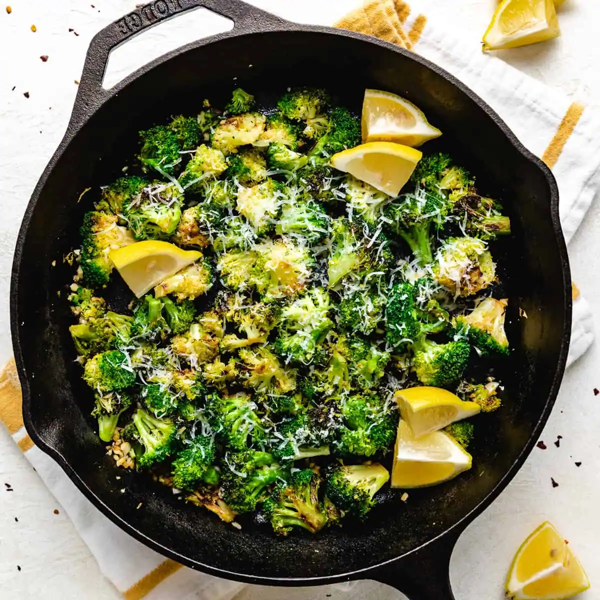 Overhead view of sauteed broccoli in a skillet.